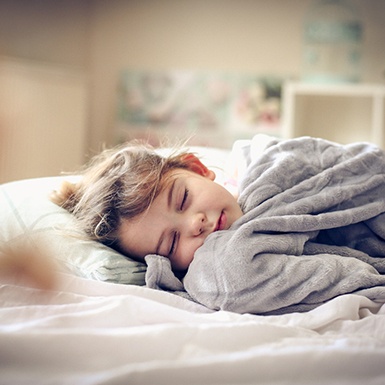 Girl sleeping in bed