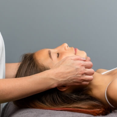 Dentist examining dental patient who is experiencing chronic jaw pain