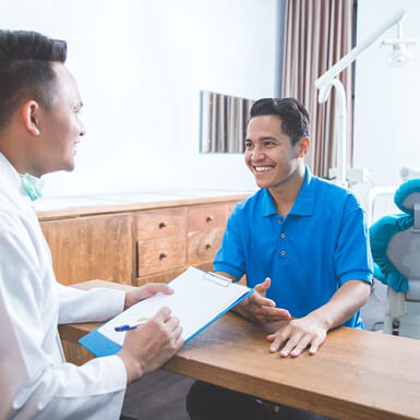 patient talking to sleep dentist