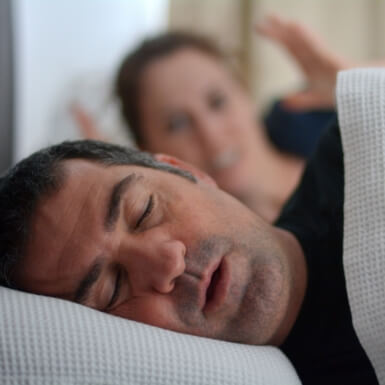 Man snoring before sleep apnea treatment