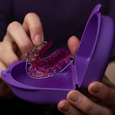 Person holding device that resembles Vivos DNA