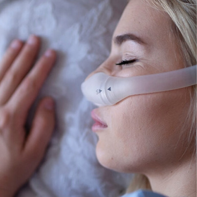 Woman with CPAP mask sleeping