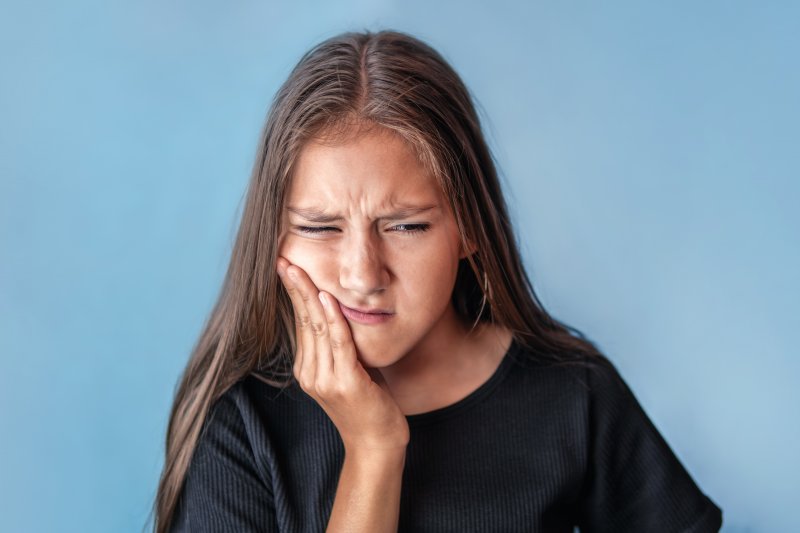 A young girl with an aching jaw from TMD