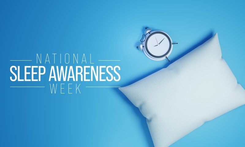 a pillow and clock for National Sleep Awareness Week